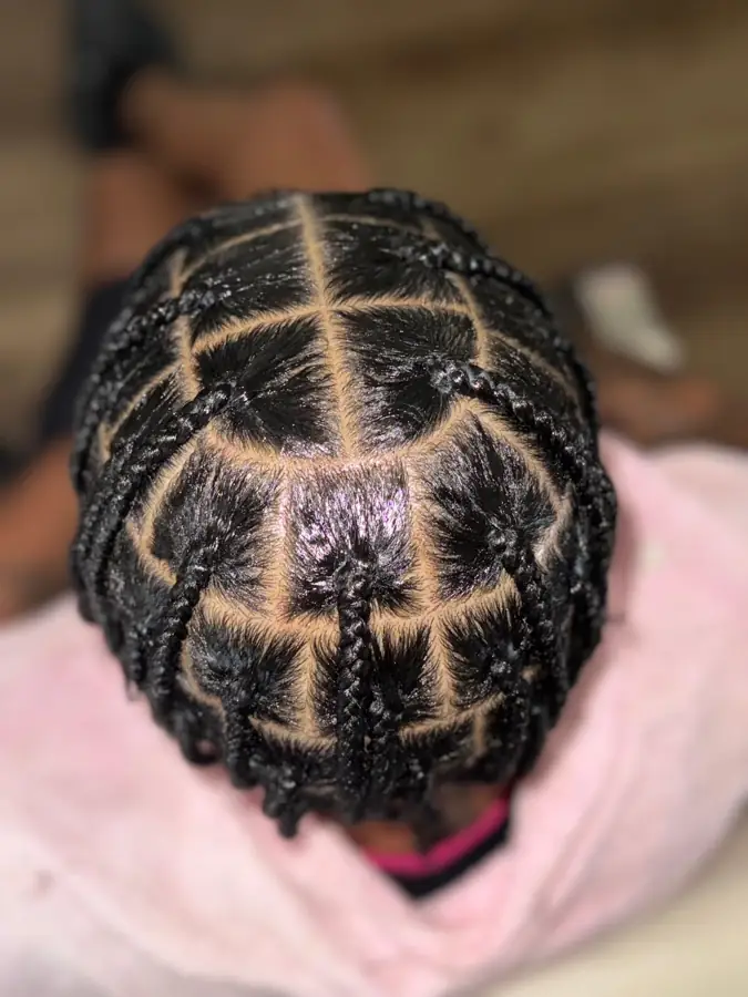 Men's box braids with large parts in Columbus, OH